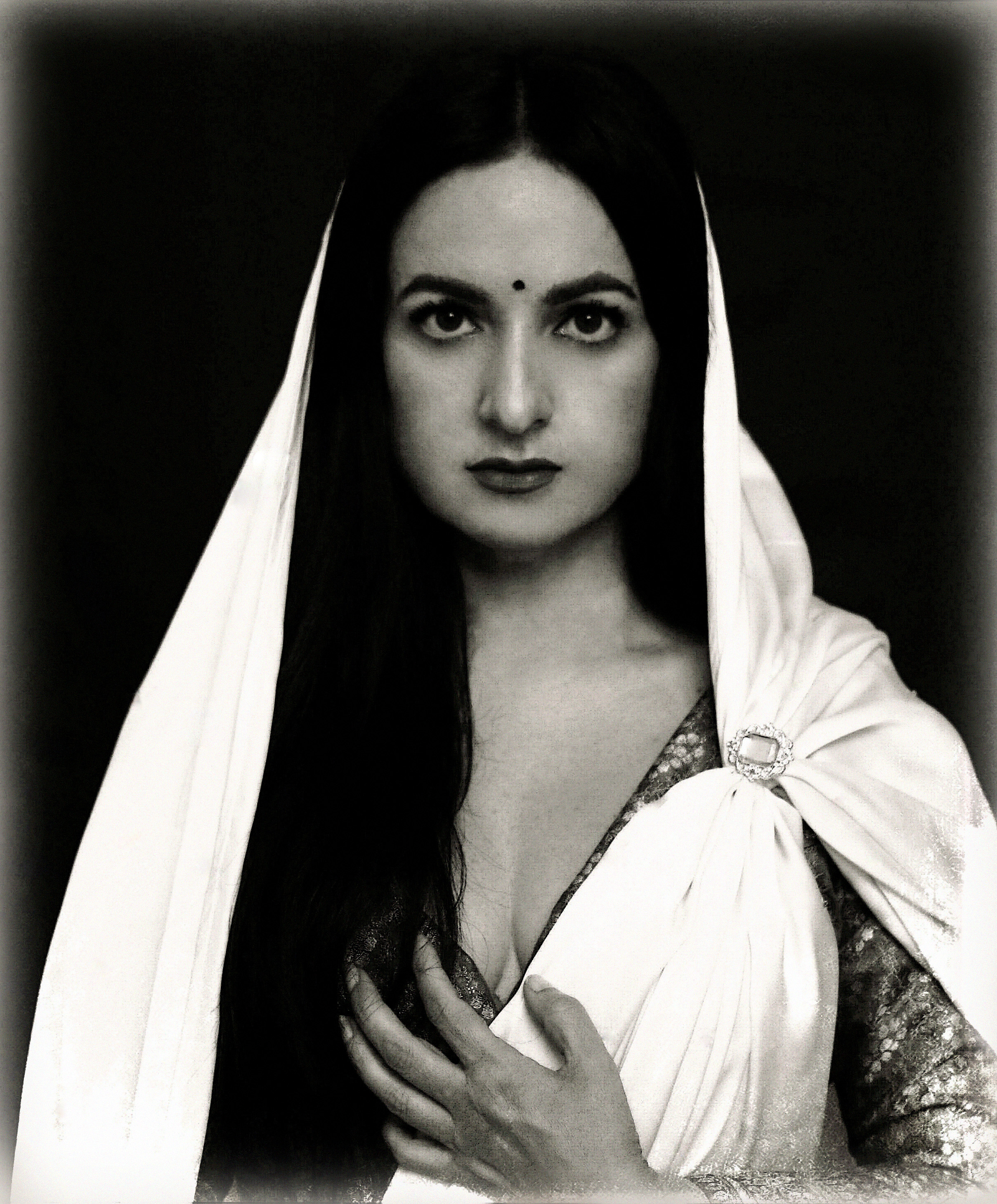 Young woman in ethnic clothing in black and white