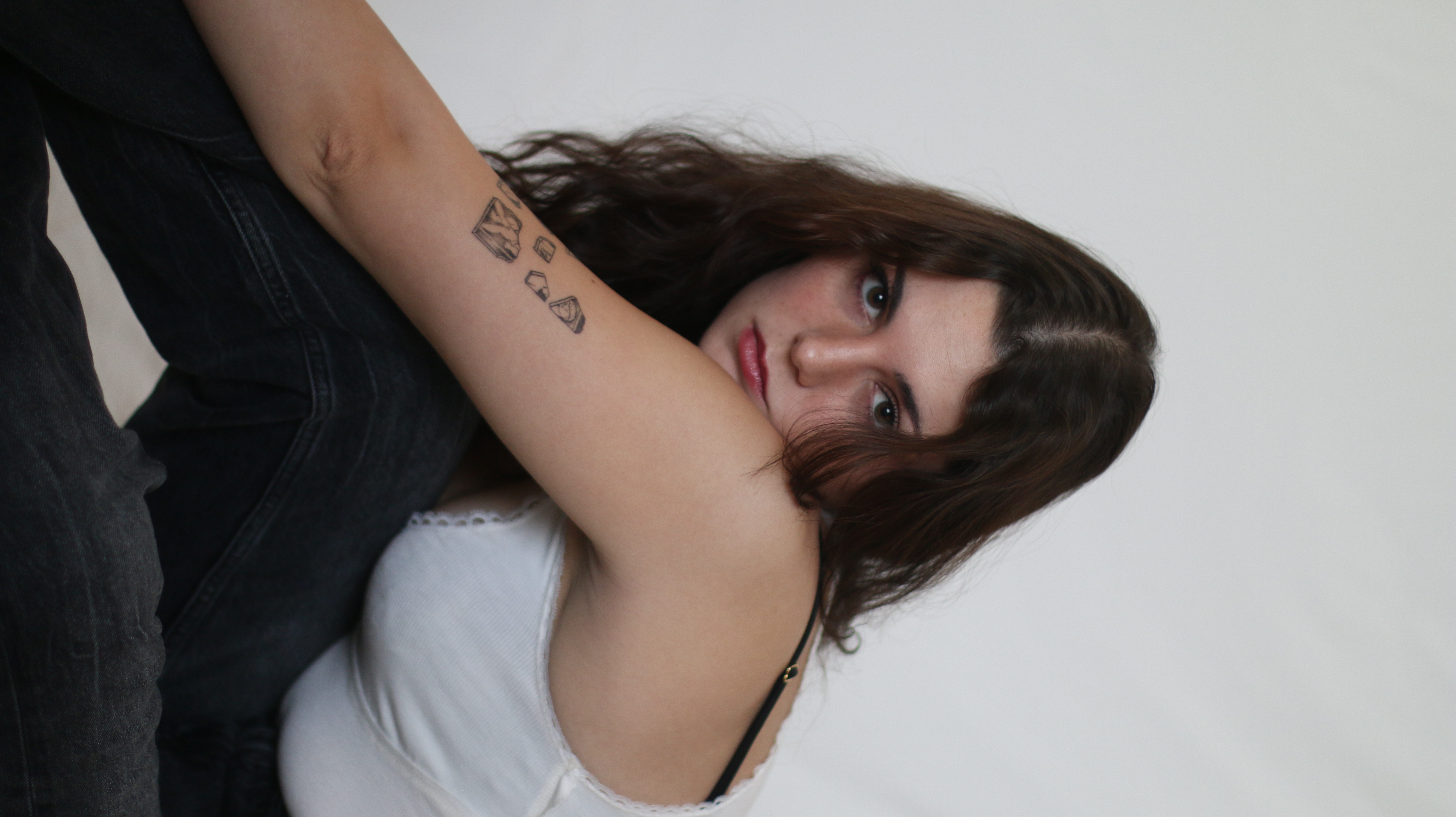 Young women in studio posing on her side 1
