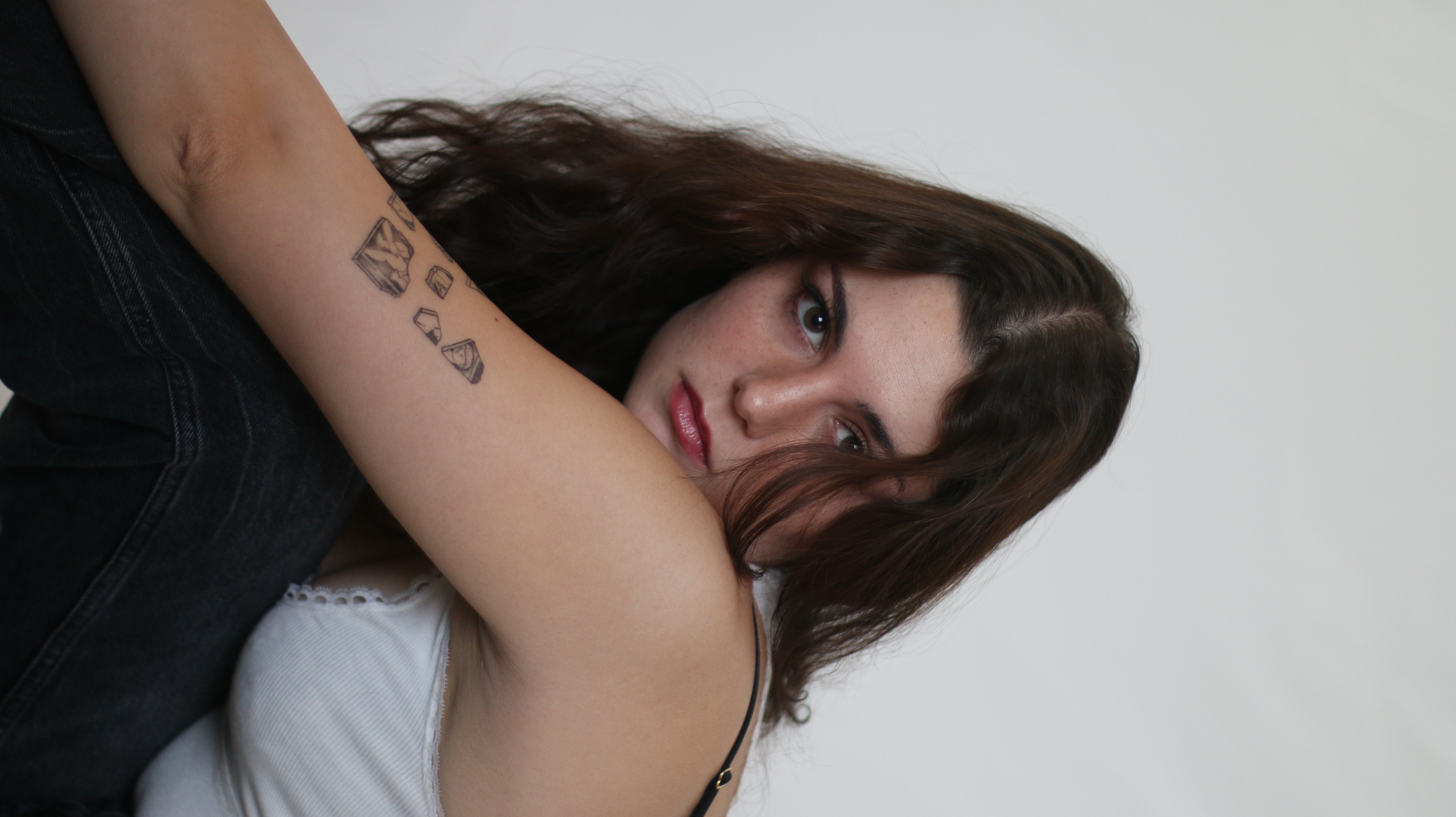Young women in studio posing on her side 2