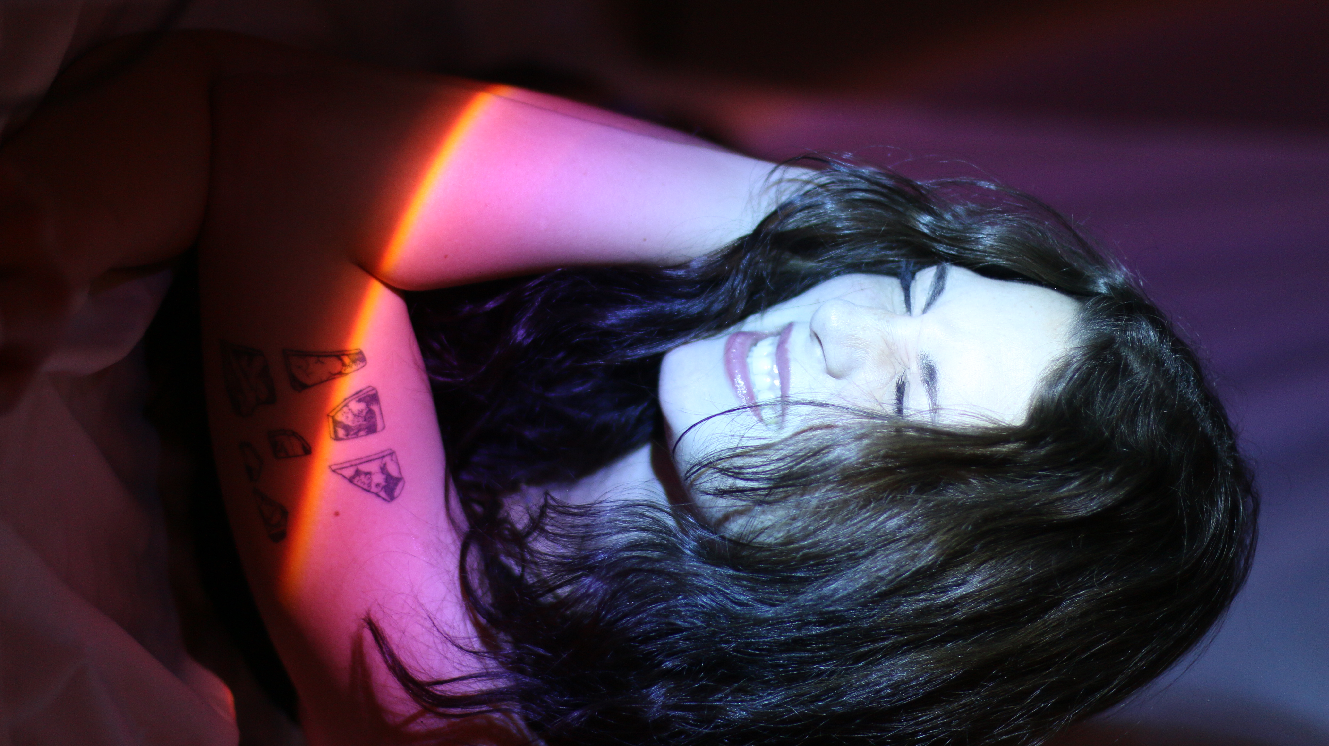 Young women in studio with dramatic lighting
