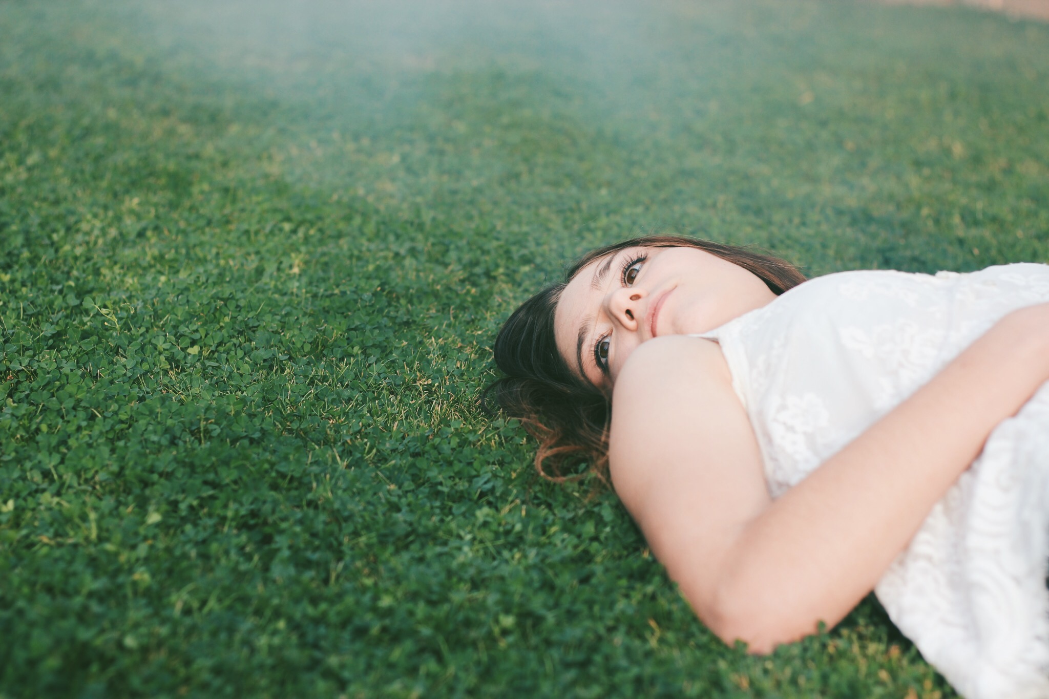 Young women laying on the grass