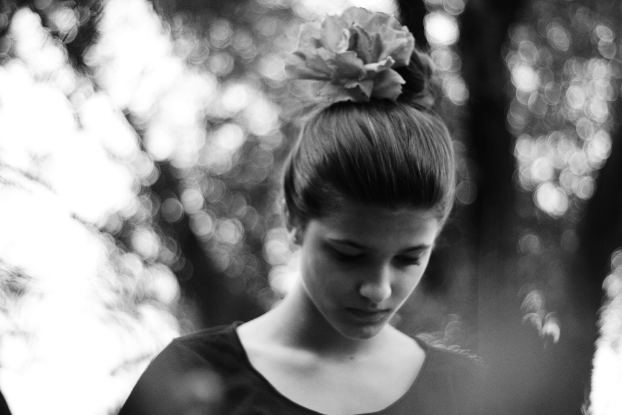 black and white young women with her hair up in a bun